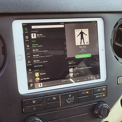 iPad tablet mount in the front dashboard of a car