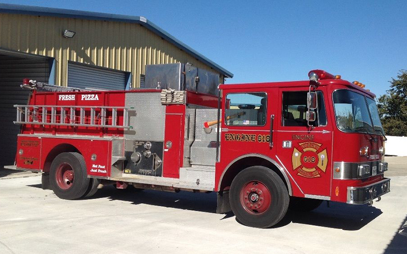 Potential customers will get hungry when they see this pizza fire engine.