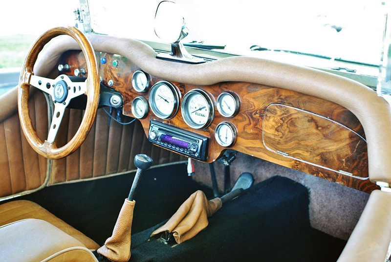 The interior is nicely appointed, with bucket seats and a wood-paneled dash with plenty of instruments.