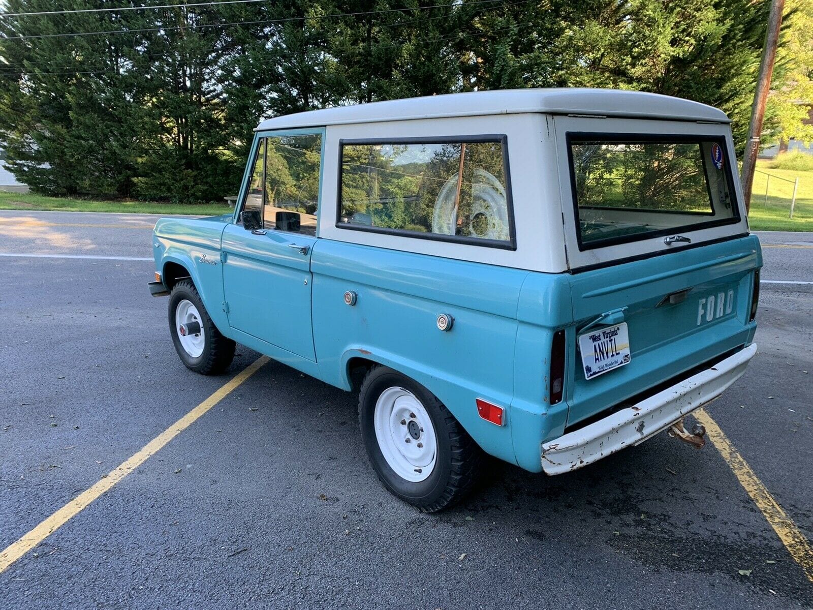 1968 Classic Ford Bronco sitting in a parking lot