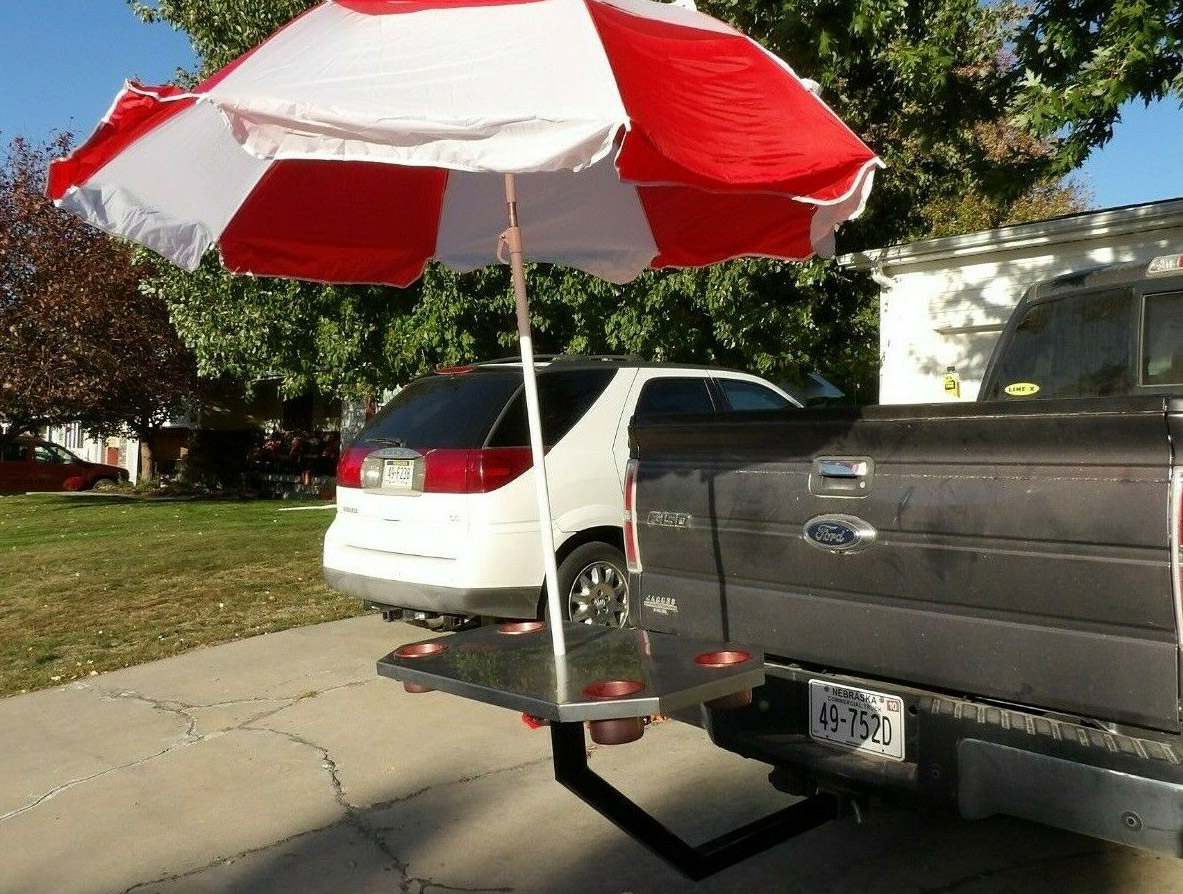 A hitch-receiver tailgate party table and umbrella is a great tailgating accessory