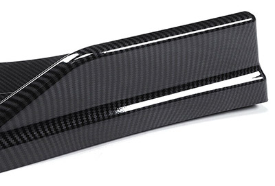 Carbon fiber bumper lip is part of a widebody kit versus a fender flare