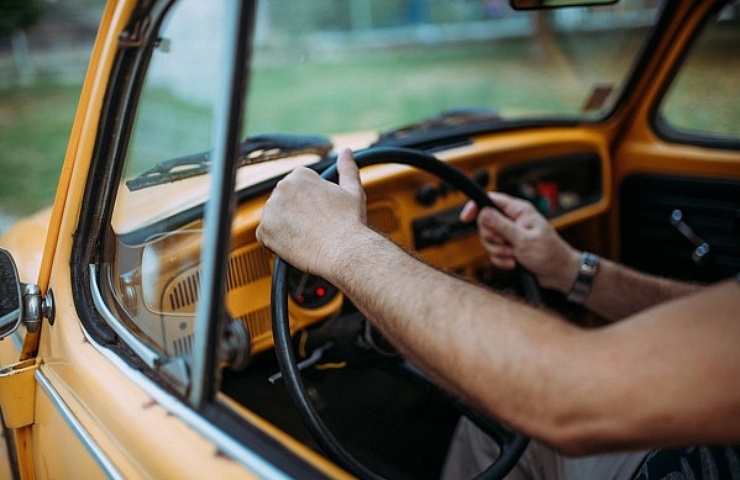 Hands on a steering wheel