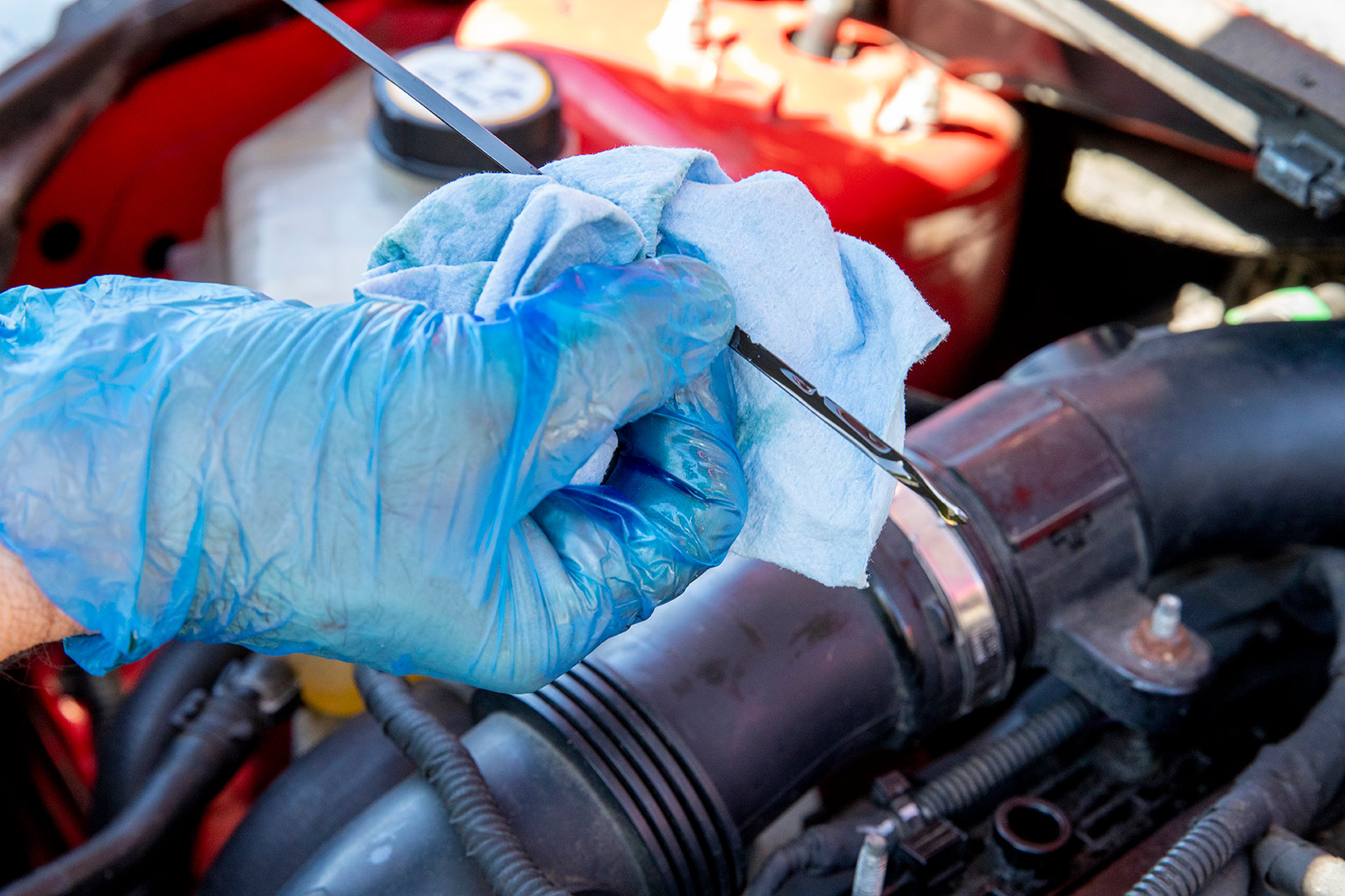 Checking the dipstick after changing your own oil