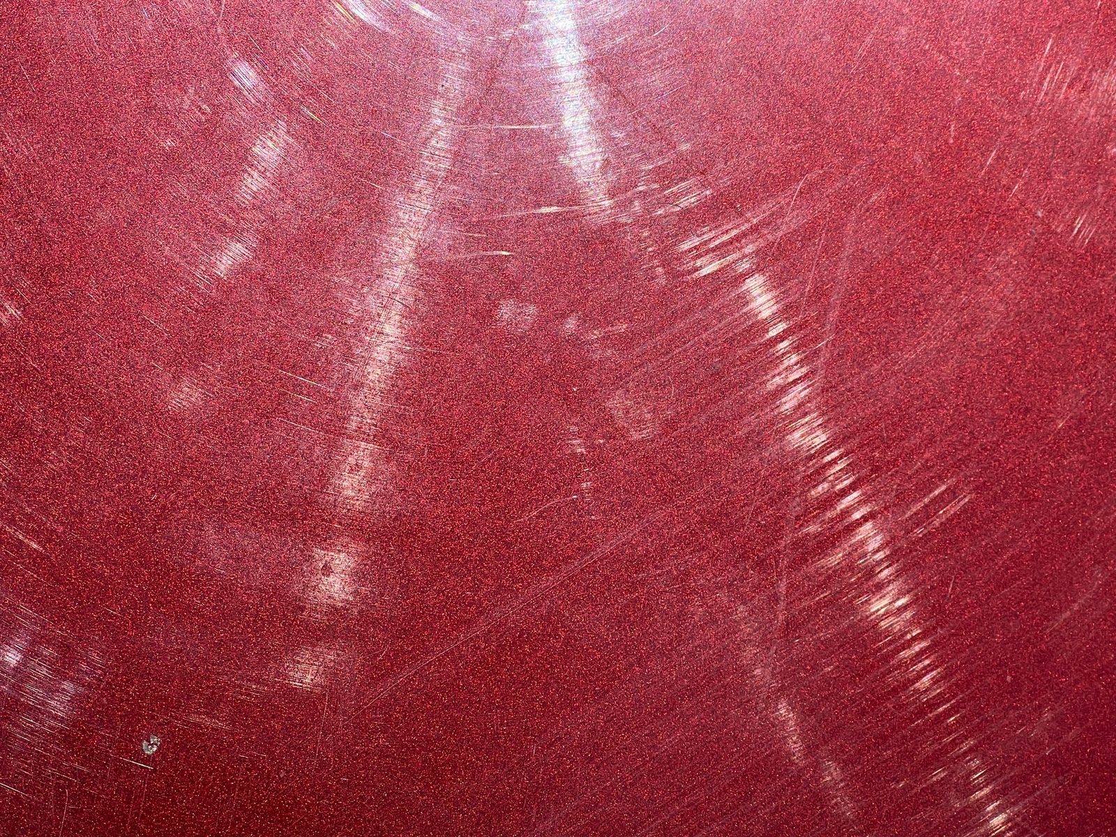 Red metallic paint with swirl marks